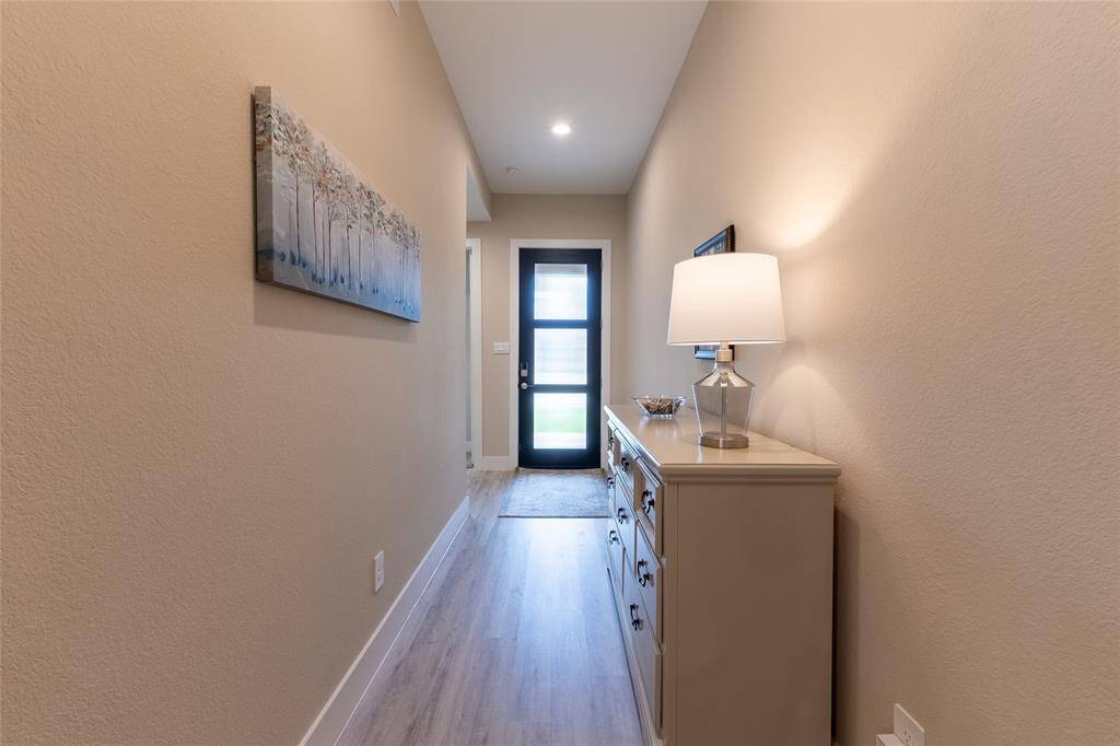 View of dining area, kitchen and entryway