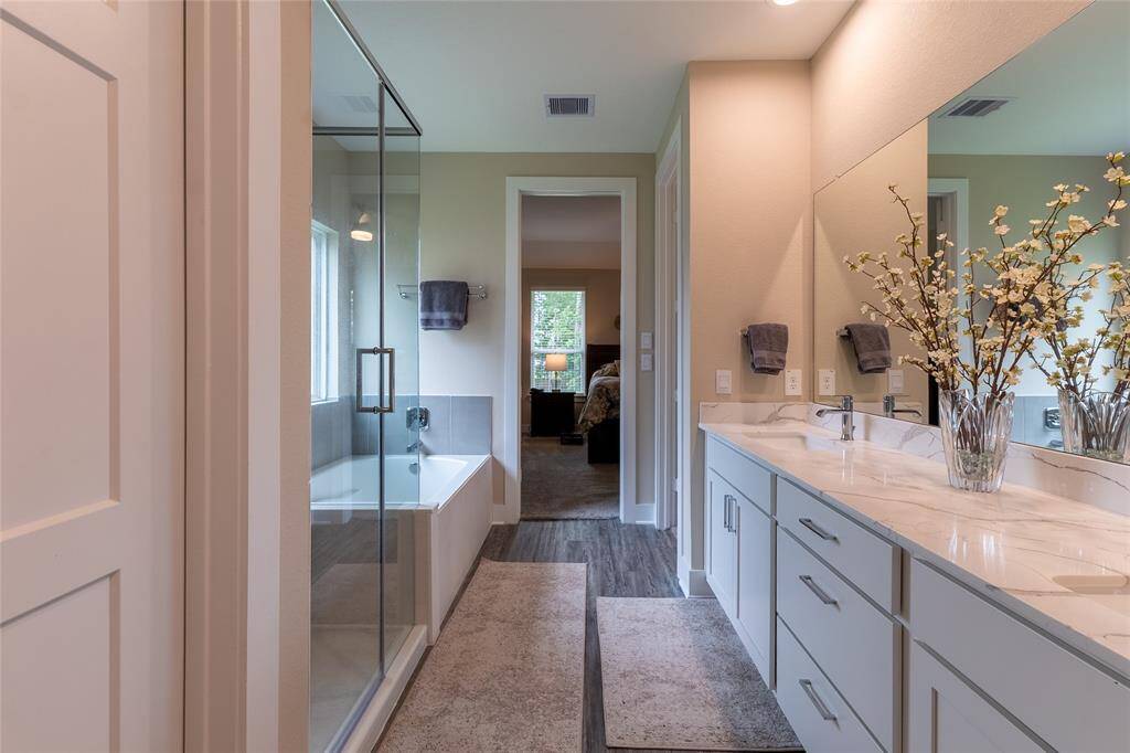 View of the quartz counters and dual sinks in Primary Bathroom