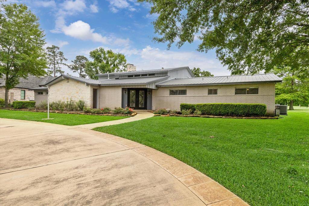Contemporary metal roof adds to timeless appeal of house.