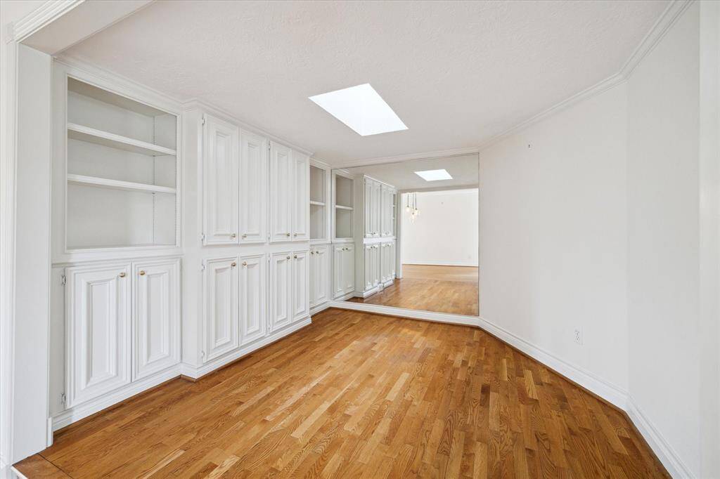 Office room with wall of built ins.