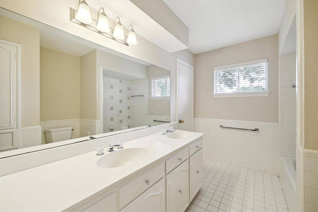 Third secondary bedroom upstairs off of the loft area. Large windows overlooking pool and golf course.