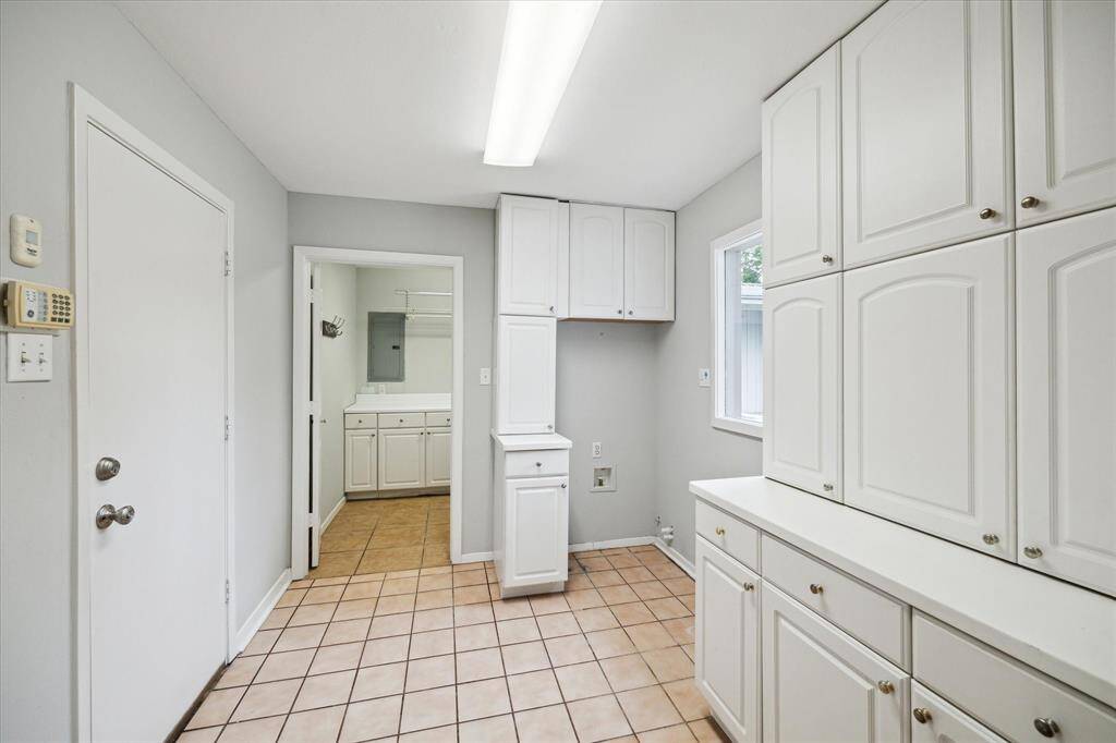 Downstairs double utility rooms off of the kitchen and garage.