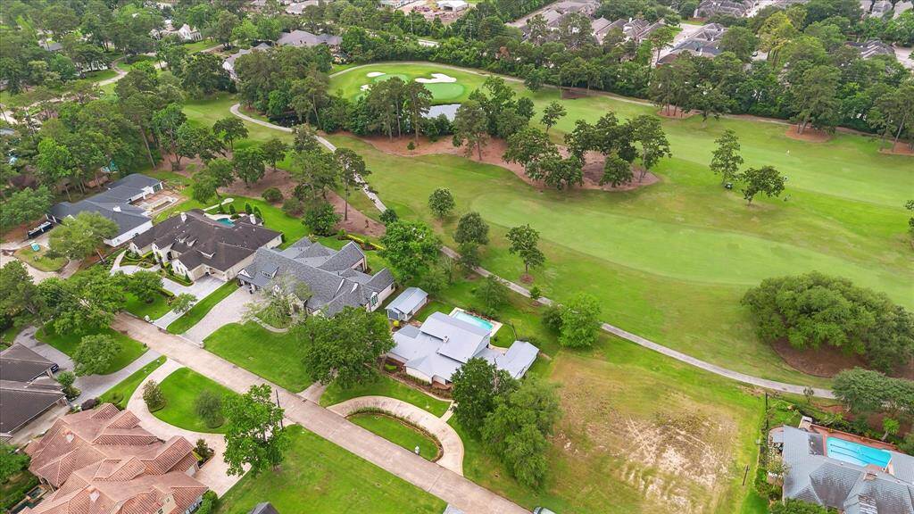 Overview shot with view of house and golf course.