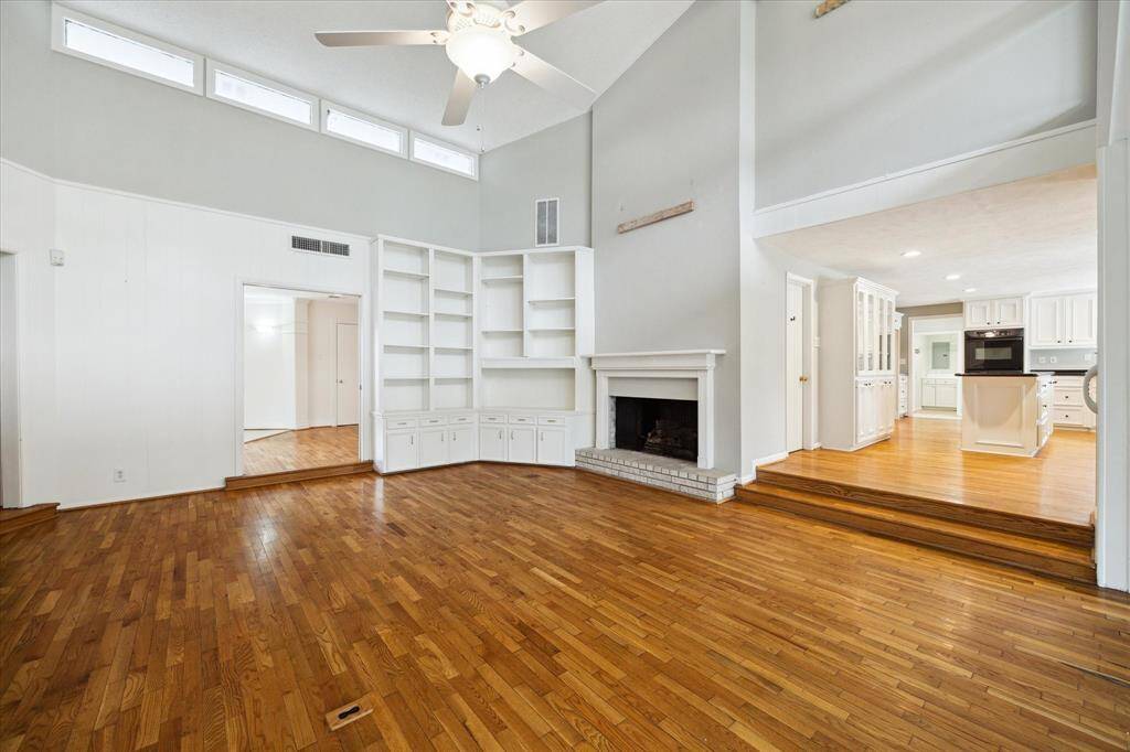 View toward kitchen on the left and front entry.