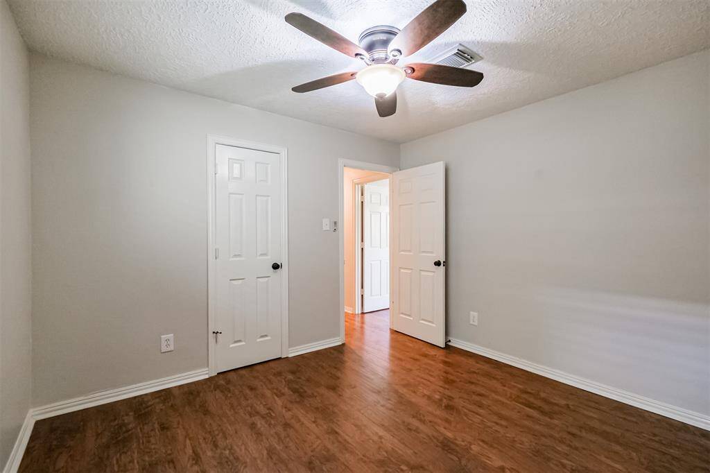 Secondary bedroom with walk in closet.