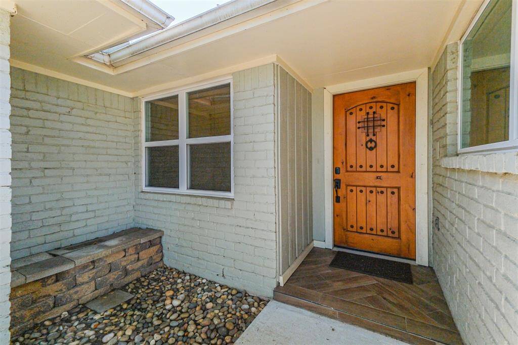 Front entry way will greet you either the solid wood decorative door.