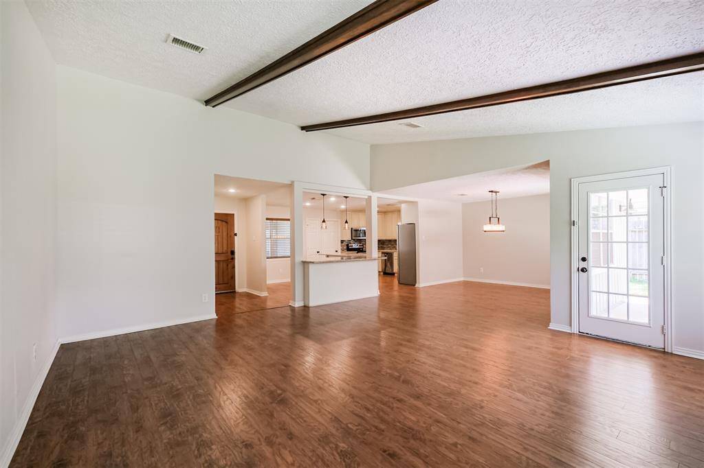 This view from the family room you cans the seamless connection to both the dining and the kitchen.