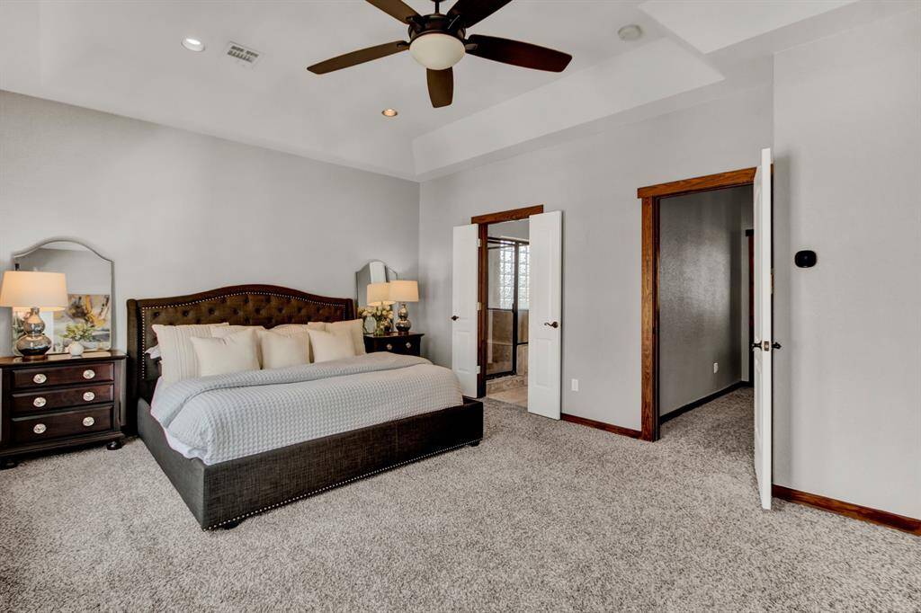 Double doors open to a luxurious en-suite, while the expansive layout provides a serene and private owner’s retreat.