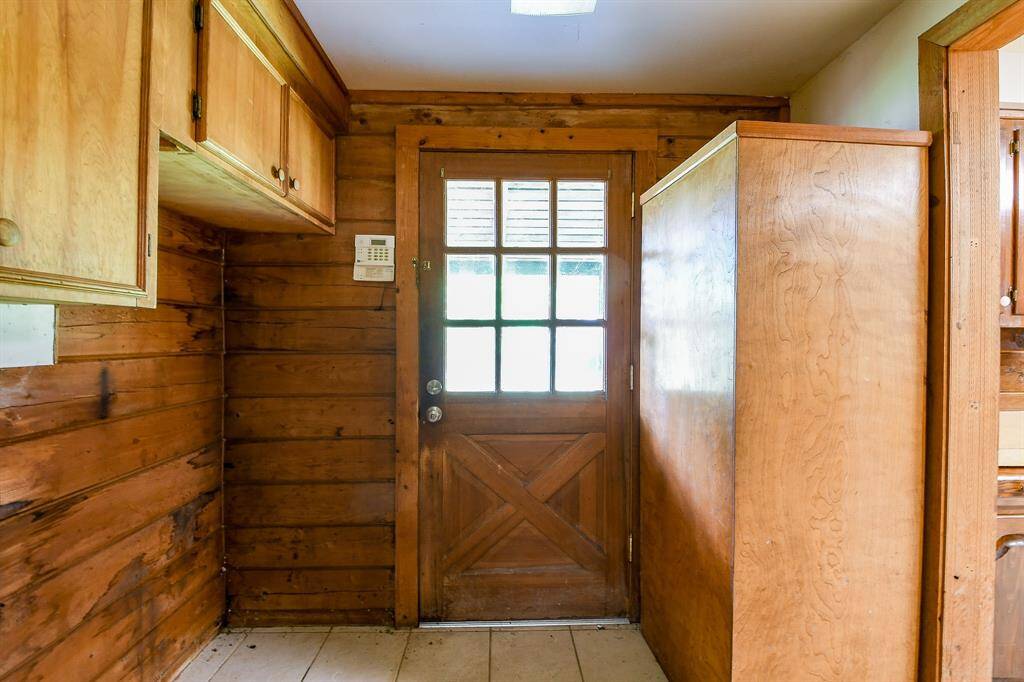 The utility room lies just off the kitchen and there's also a door (not pictured) that connects to the primary bathroom.