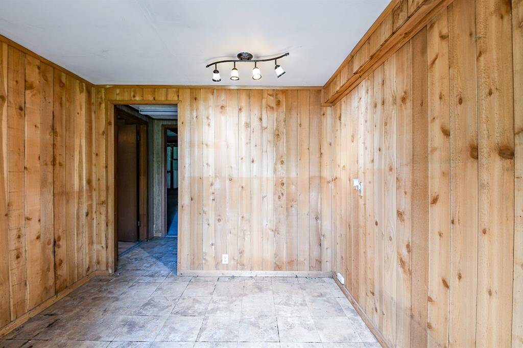 As you enter the metal building through the main door, you walk into this reception area. This room used to have a reception desk for the former business.
