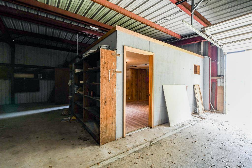 A view from inside the metal building looking into the office space.