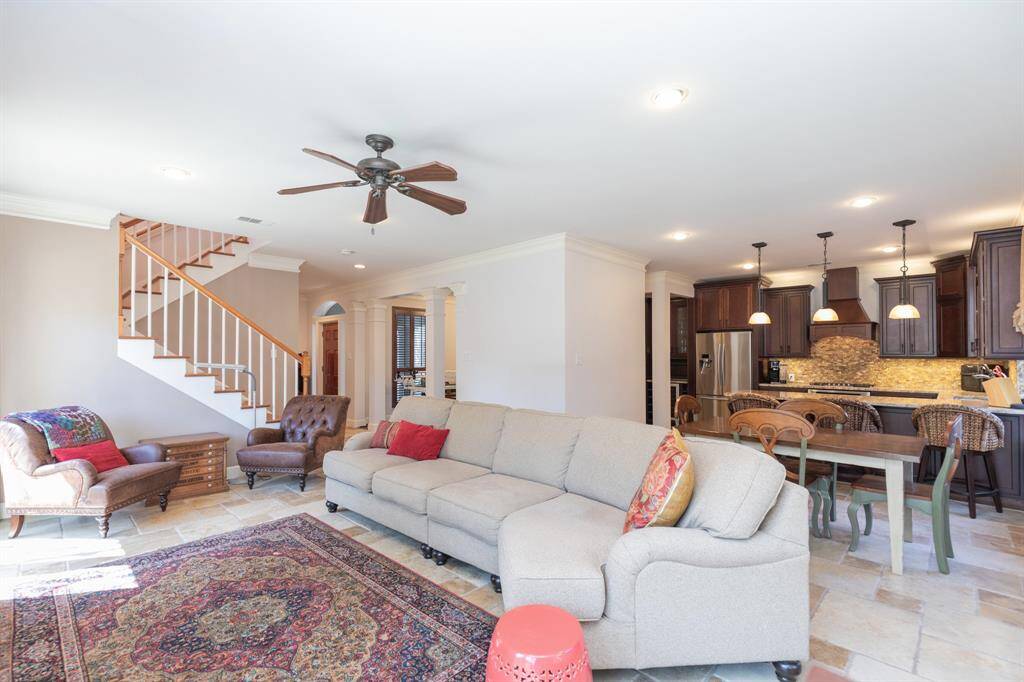 Family room, with stairs, entry hall and kitchen