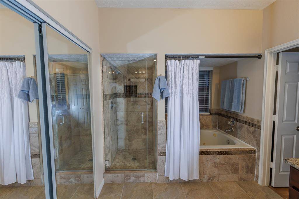 Jetted tub and separate shower in the Master bathroom.
