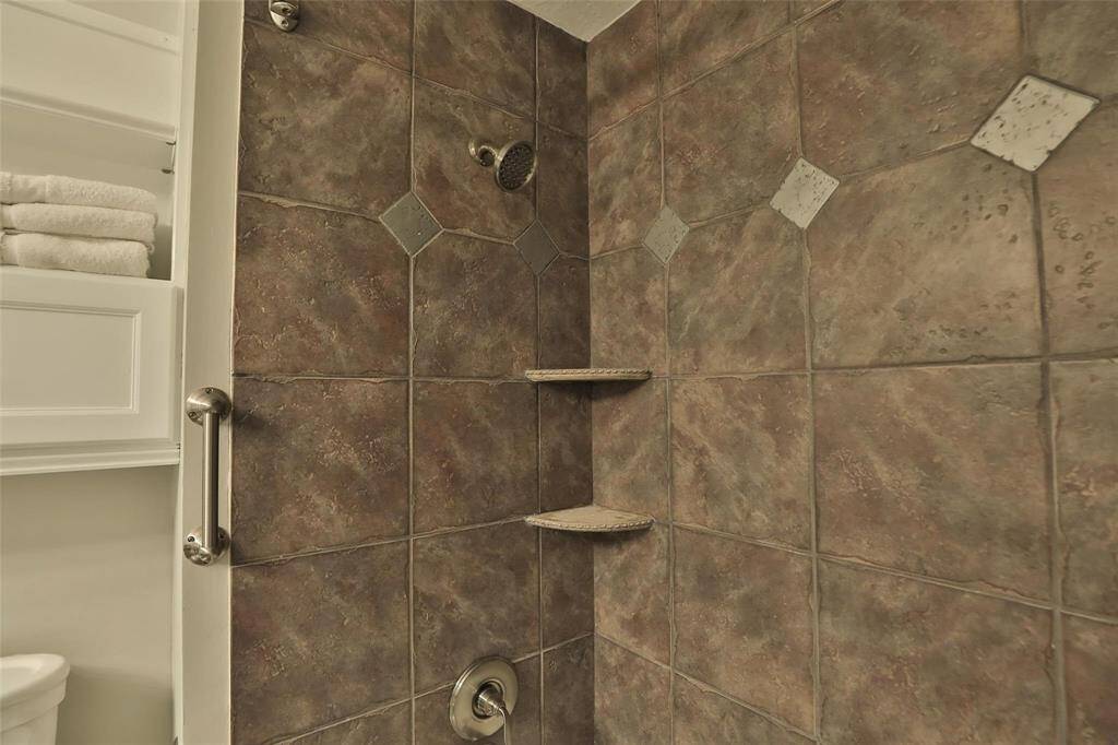This is a close up of the primary tub and shower.