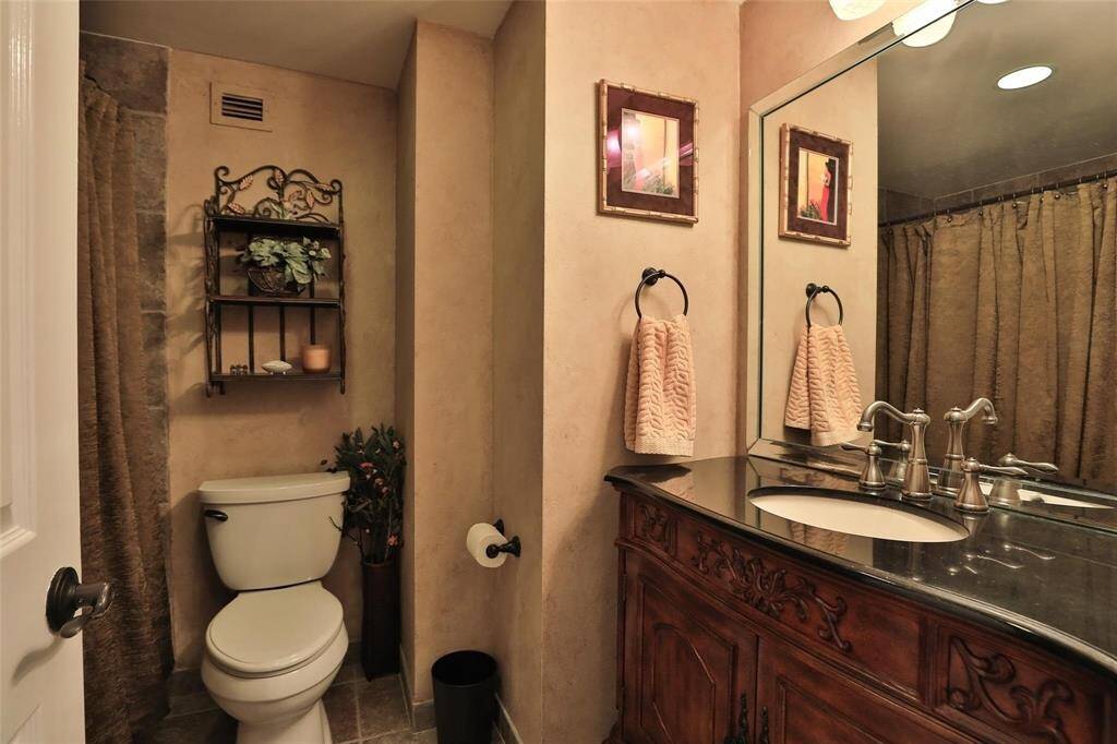 This third bathroom serves the bedroom across the hall and the living areas.