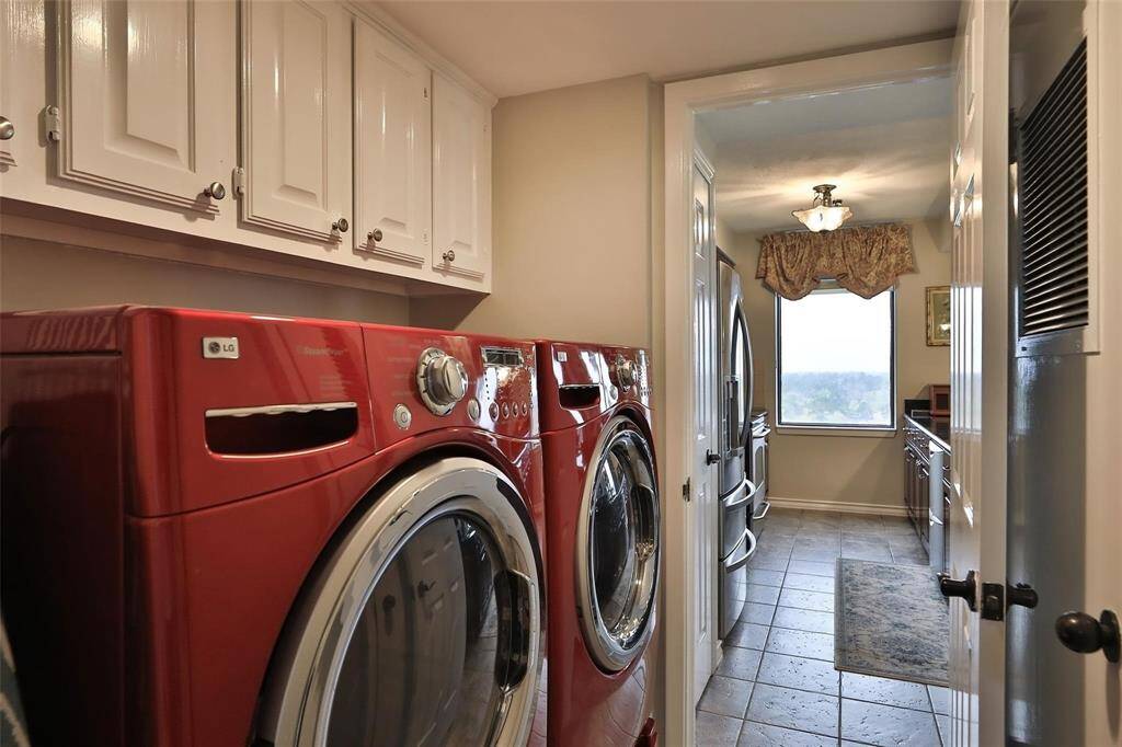 The laundry room includes full sized washer and dryer.