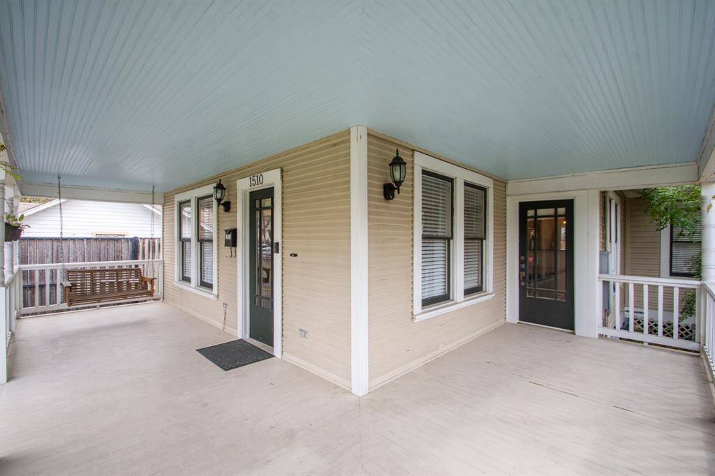 This inviting wraparound porch offers plenty of space to relax and unwind, featuring a charming porch swing, classic lighting, and a soft blue ceiling for a touch of Southern elegance. Perfect for morning coffee or evening gatherings, this space enhances the home's warm and welcoming appeal.