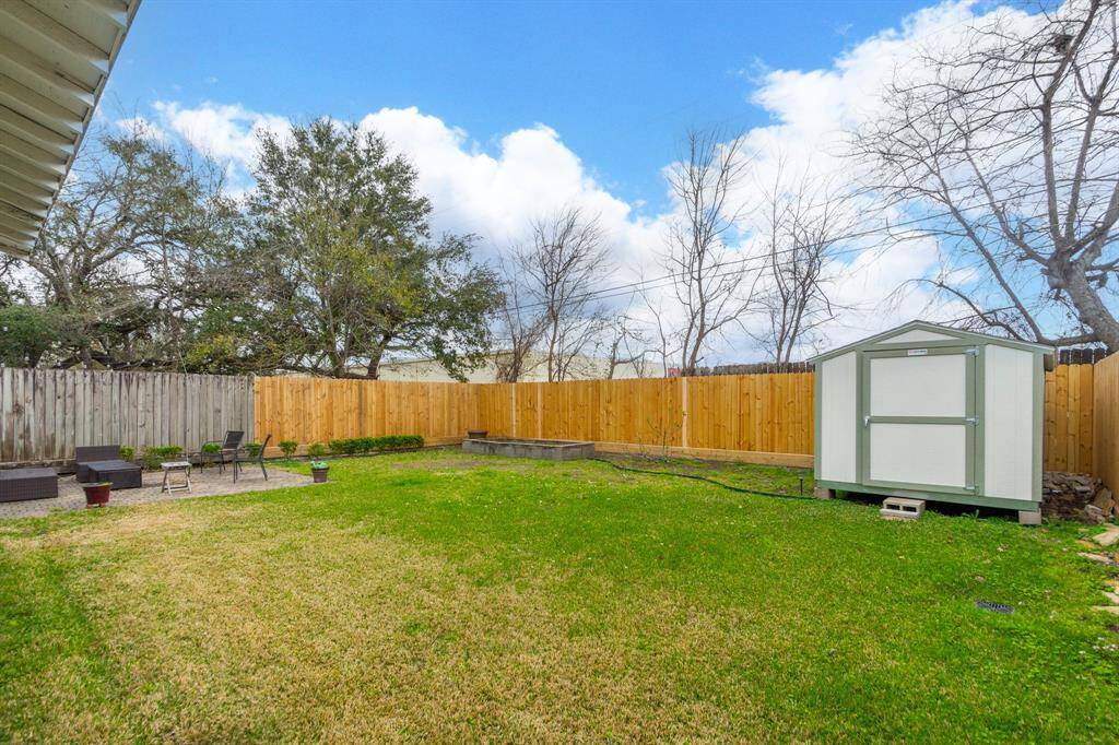 A well-maintained lawn with plenty of room for a storage shed, ideal for family activities and storage needs.