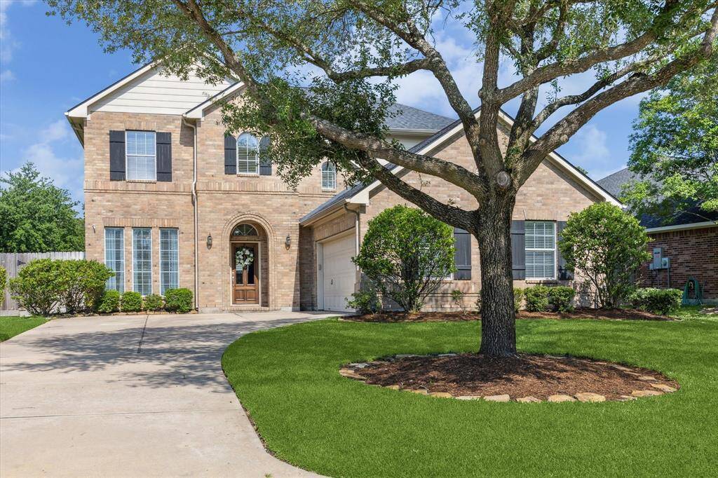 Welcome to 15127 Woodford Hollow Lane, in the gated community of the Reserve at Cypress Creek!