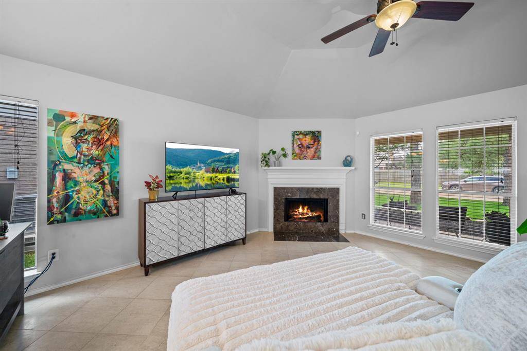 Notice the tile that accents the fireplace. Large windows letting in just enough light!