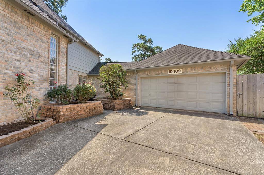 A  spacious driveway with attractive brickwork leads to your two car garage. The low-maintenance landscaping includes mature shrubs and a small garden area.