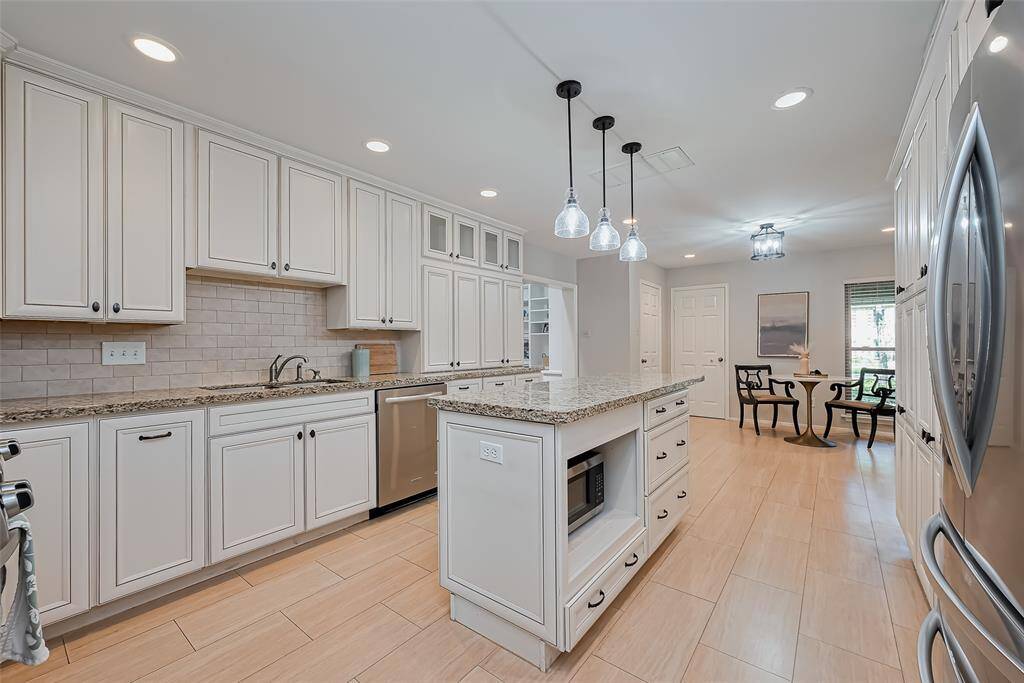This center island makes cooking a breeze. Tons of space to prepare food.