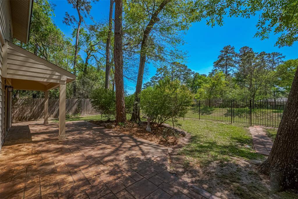 A large custom back patio with plenty of room for entertaining.