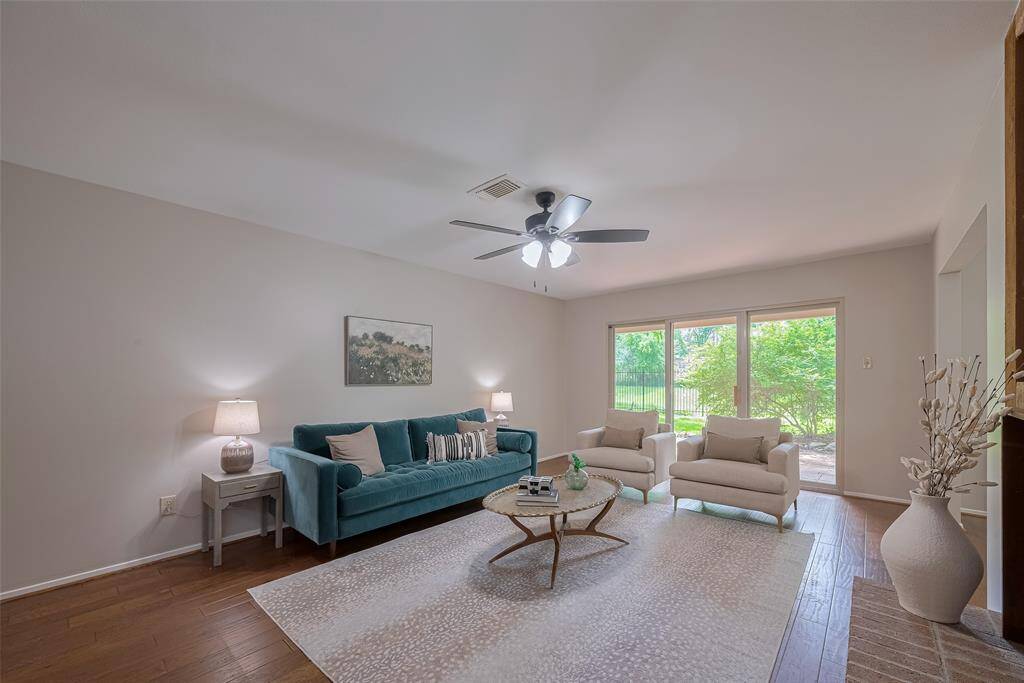 Large windows on each side of the sliding door bring in so much natural light.