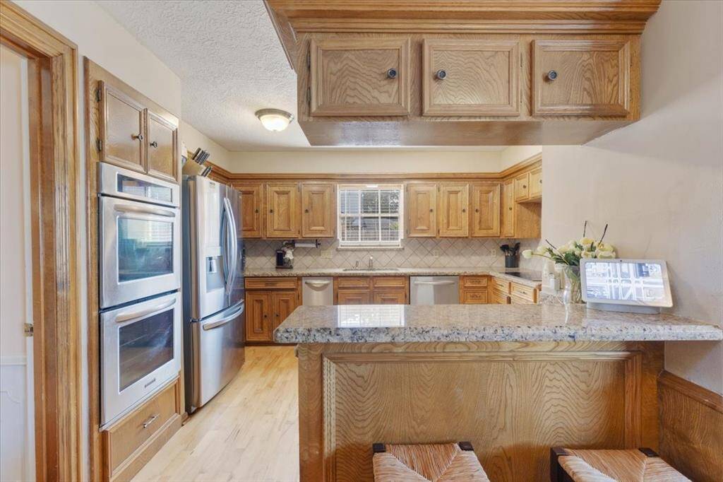 Kitchen featuring granite countertops and a double oven