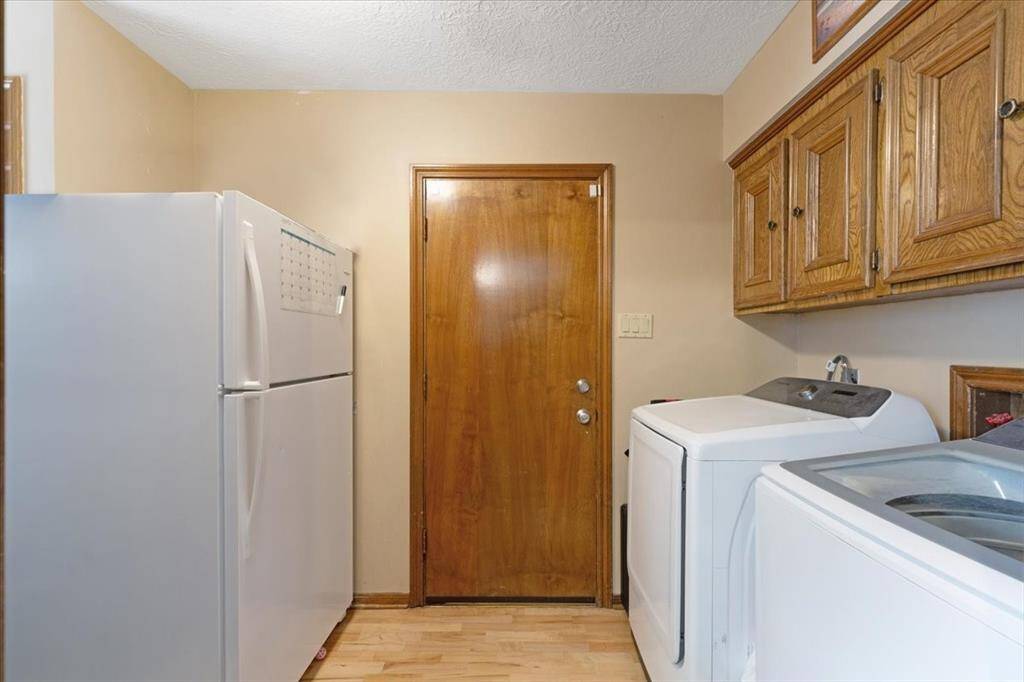 Laundry & utility room just off the kitchen to the back.