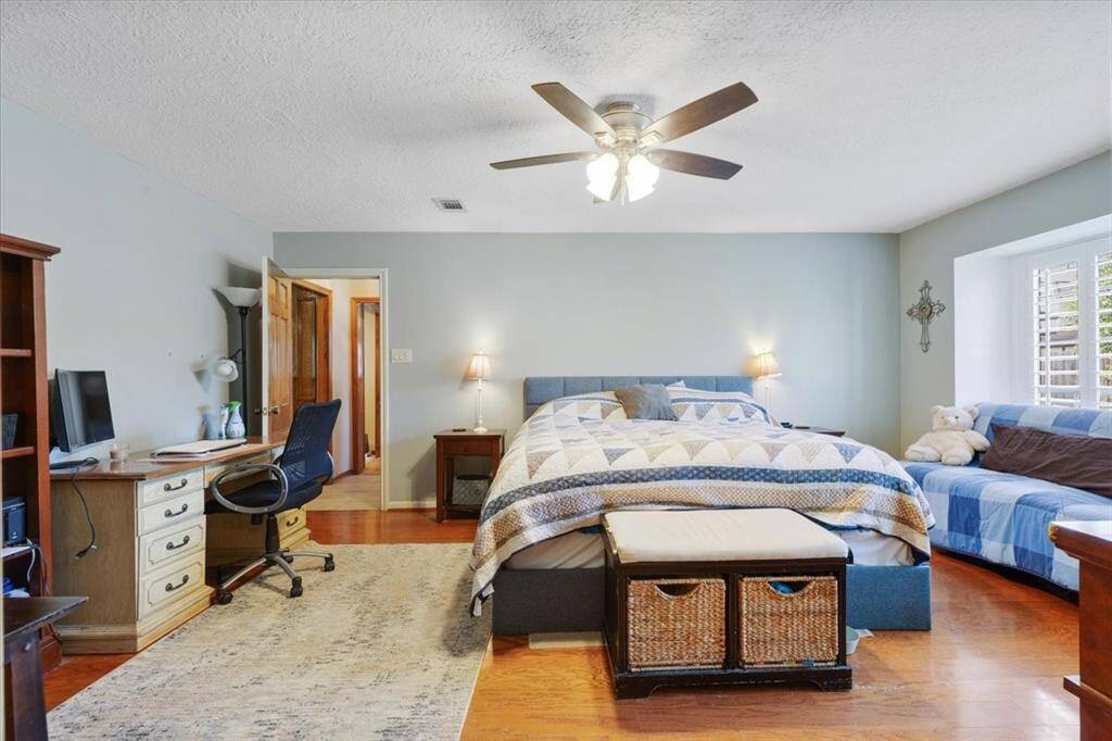Another view of the primary bedroom