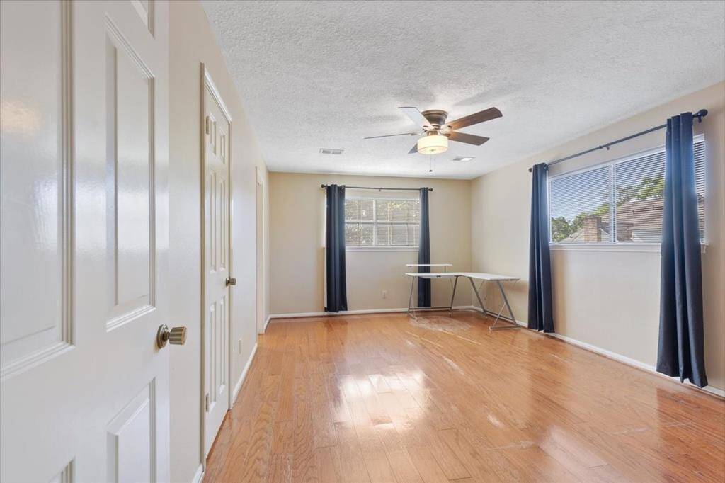 Secondary bedroom upstairs with a walk in closet.