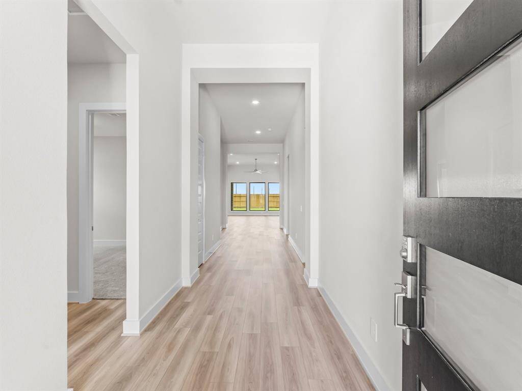 12 Ft. Entry Ceiling and Luxury Vinyl Plank Flooring As You Enter