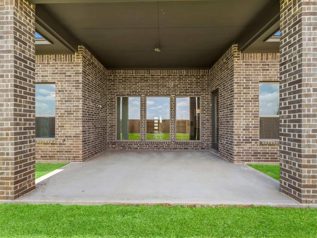 Fabulous Covered Rear Patio is Pre-wired for a Fan