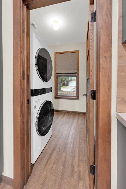 Stacked washer and dryer included.