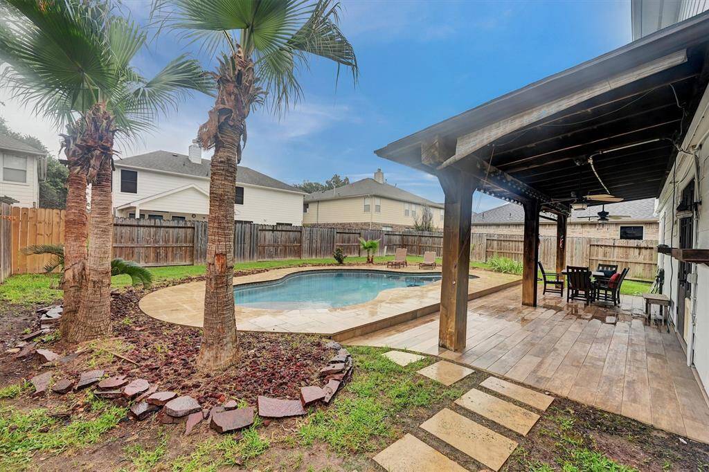Freshly trimmed trees and power washed deck.