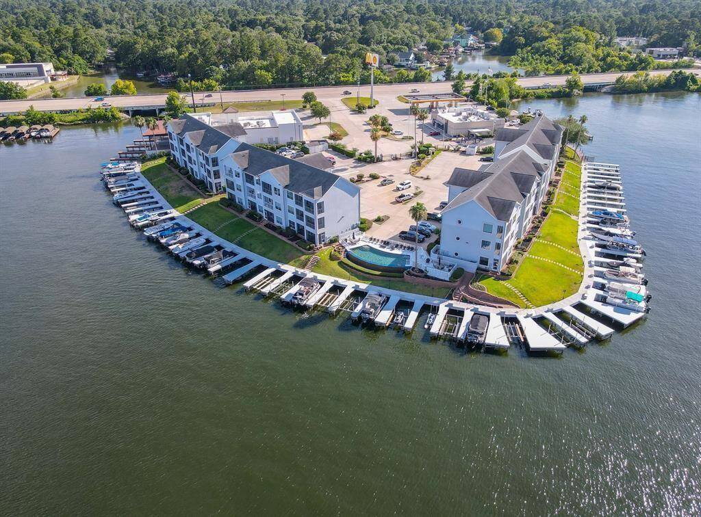 An aerial looking over this long loved lakefront condominium community surrounded by waterfront views and prime location.