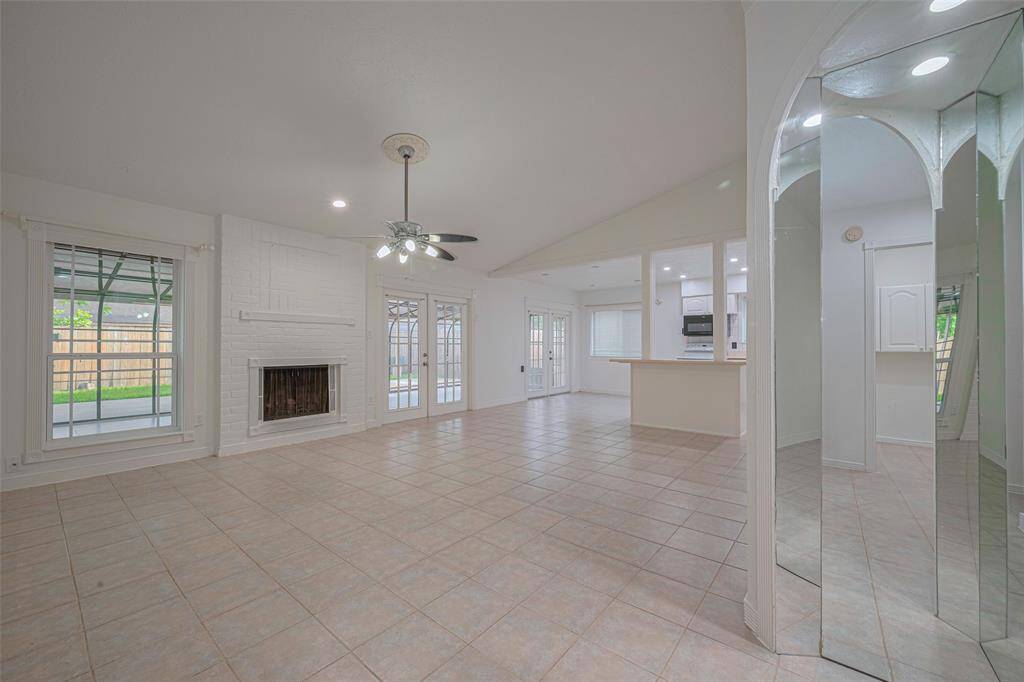 Tile flooring throughout, recessed lighting, and updated fixtures for a modern touch.