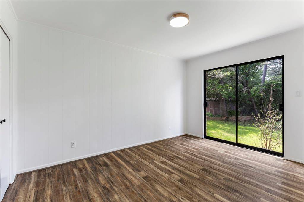 Secondary bedroom overlooking the very private backyard.