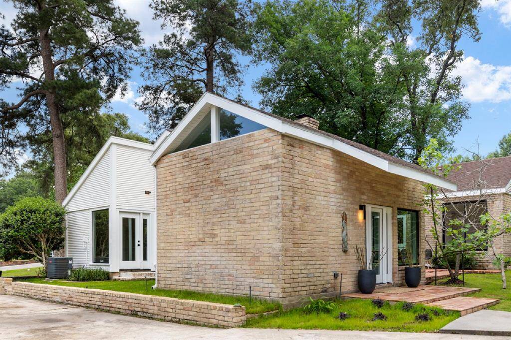 The mid-century triangular window, allows natural light into the library space.