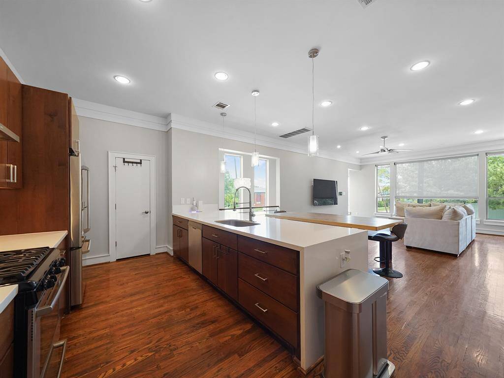 This kitchen boasts abundant storage options and plenty of counter space, making meal prep a breeze. A spacious pantry provides the ultimate in organized storage, keeping your kitchen clutter-free and ready for anything.