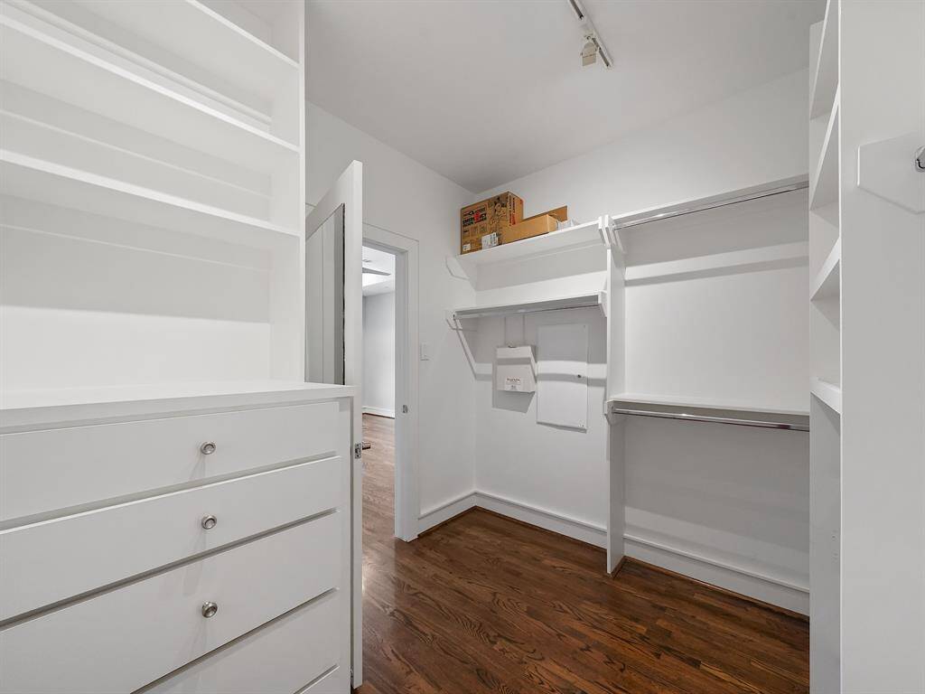 Enjoy ample storage in this bathroom featuring an extended vanity with dual sinks. Perfect for busy mornings, this space provides both functionality and style.