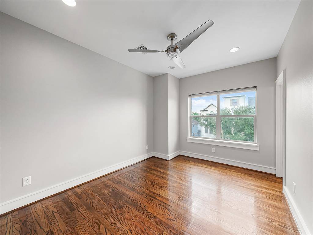 The third-floor secondary bedroom offers the convenience and privacy of its own ensuite bathroom.