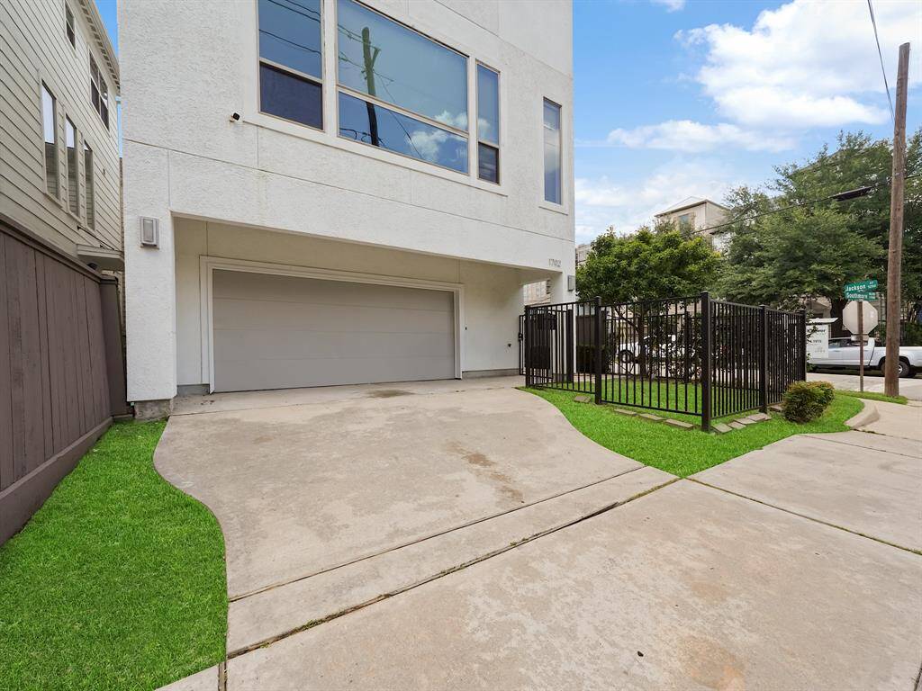 The garage has just been given a fresh coat of paint, enhancing its modern appeal and is equipped with an automatic garage door opener.