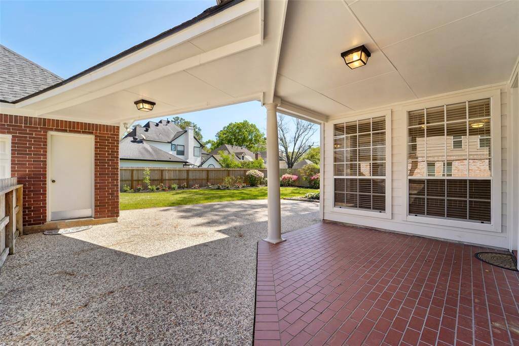 Covered walkway to the detached garage