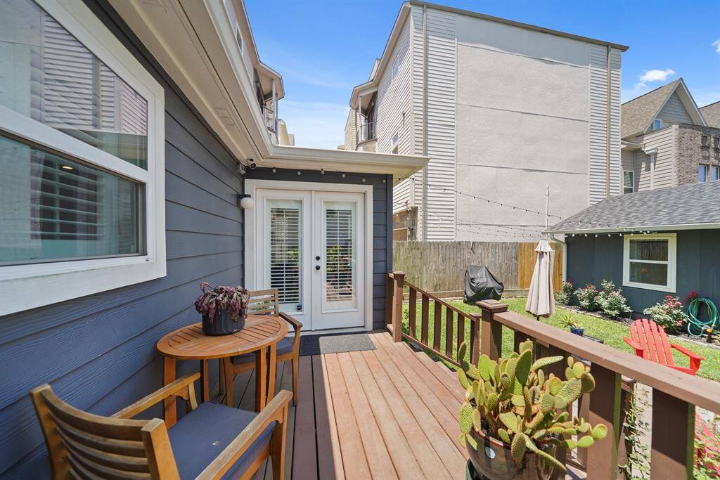 This photo showcases an alternate view of the cozy backyard deck with charming outdoor space for relaxation and entertainment.