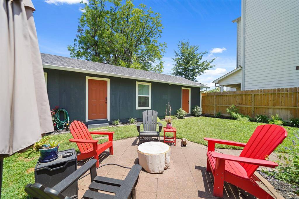 Charming backyard perfect for relaxing or entertaining.