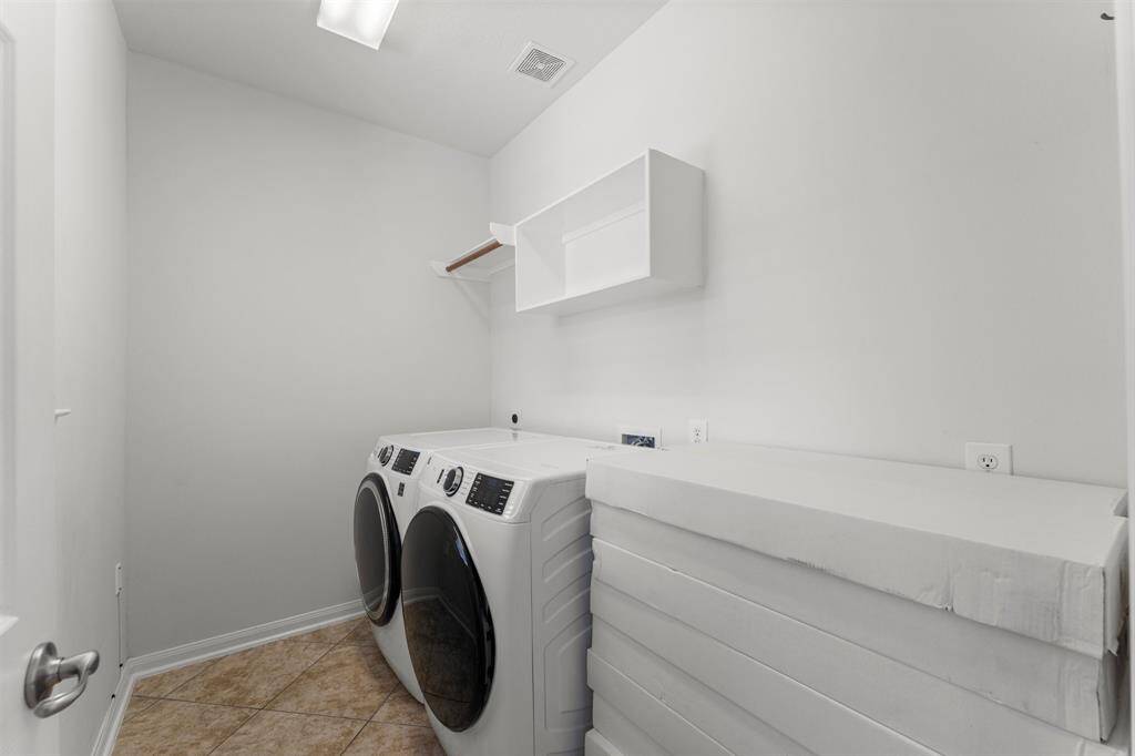 Large laundry room with space and electrical for secondary fridge/freezer