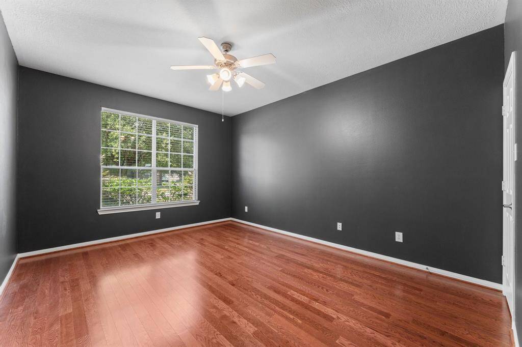 Large home office with views of the front yard