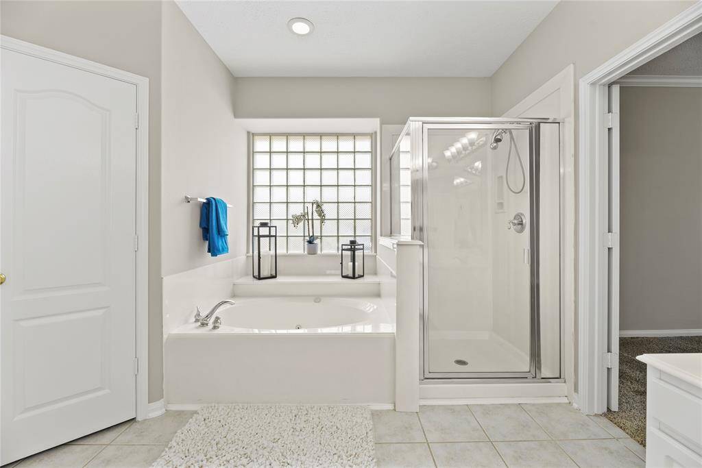 Jetted tub and separate shower.